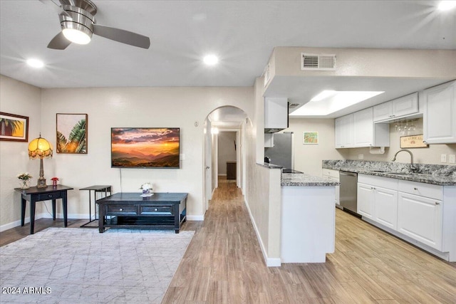 7502 E Carefree Dr Unit 106, Carefree, AZ 85377 - kitchen with visible vents, a sink, white cabinetry, arched walkways, and appliances with stainless steel finishes