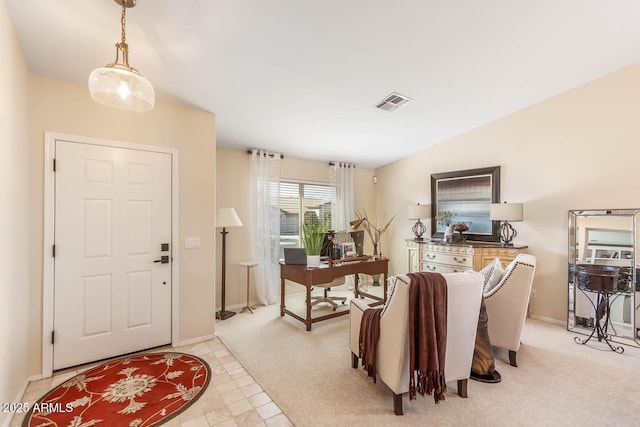 foyer entrance with lofted ceiling, visible vents, and baseboards