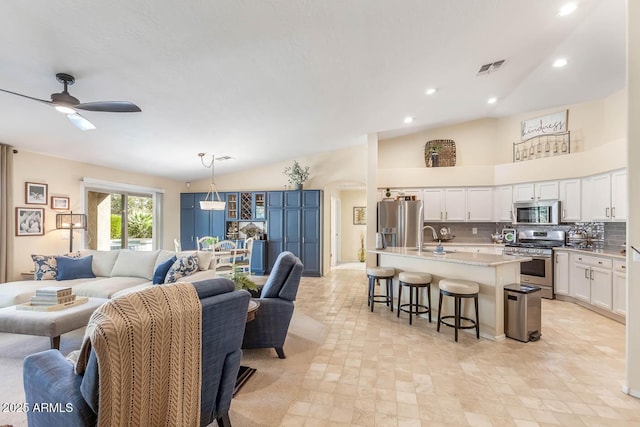 interior space featuring arched walkways, ceiling fan, high vaulted ceiling, recessed lighting, and visible vents