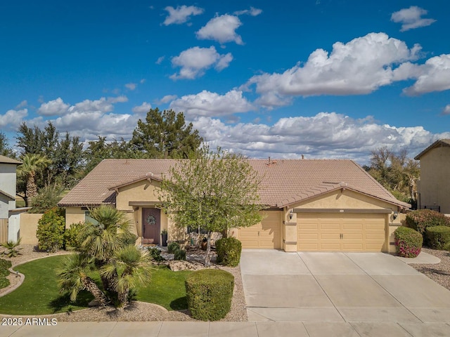 view of front facade featuring a garage, a tiled roof, driveway, and stucco siding