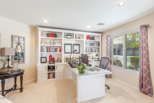 office space featuring light carpet, visible vents, baseboards, and recessed lighting