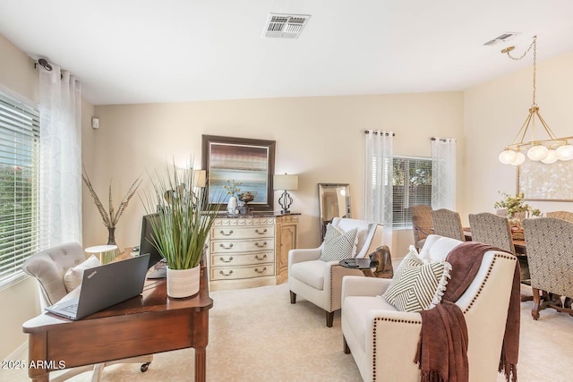 living room featuring lofted ceiling, visible vents, and light colored carpet