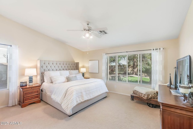 bedroom featuring multiple windows, visible vents, and light colored carpet