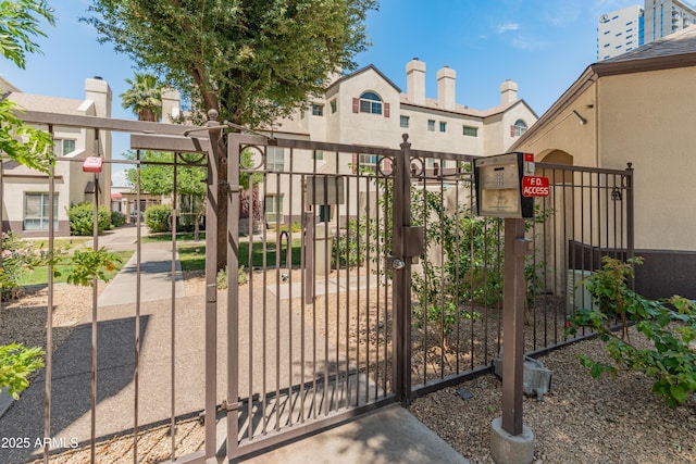 view of gate featuring fence