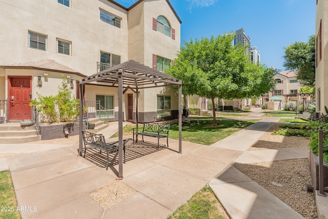 view of property's community with a patio area