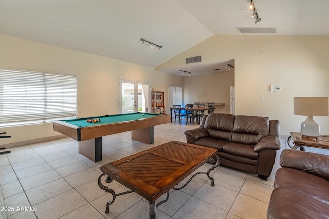 game room with light tile patterned flooring, visible vents, track lighting, and vaulted ceiling