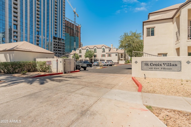 view of road featuring a residential view and curbs