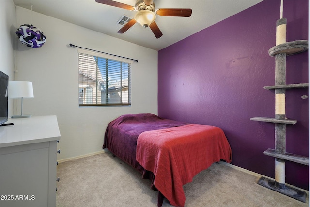 bedroom featuring baseboards, a ceiling fan, visible vents, and light colored carpet