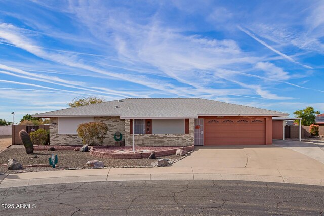 ranch-style house featuring a garage