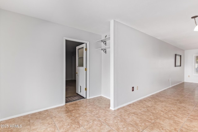 empty room featuring light tile patterned floors