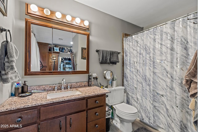 3207 N Steves Blvd, Flagstaff, AZ 86004 - bathroom featuring toilet, a shower with curtain, and vanity