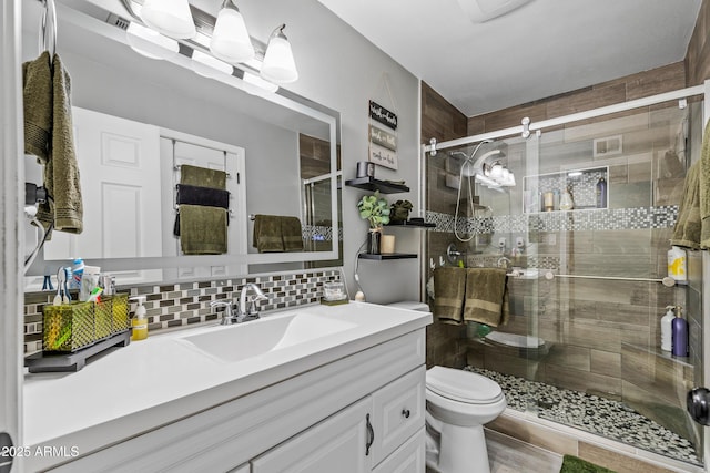 3207 N Steves Blvd, Flagstaff, AZ 86004 - full bath featuring toilet, a shower stall, backsplash, and vanity