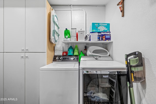 3207 N Steves Blvd, Flagstaff, AZ 86004 - laundry area featuring cabinet space and separate washer and dryer