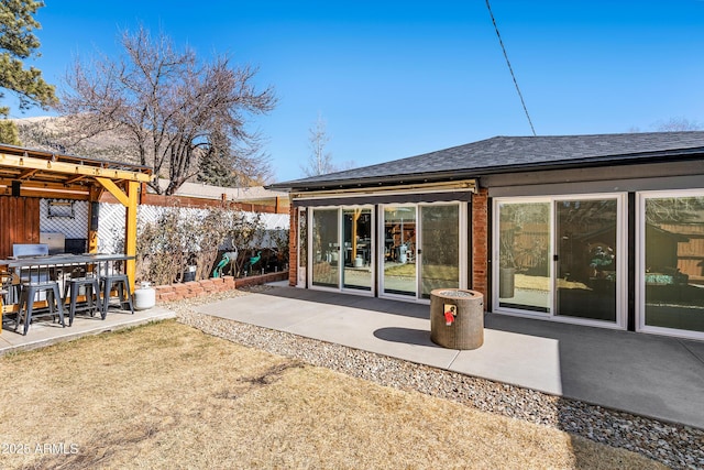 3207 N Steves Blvd, Flagstaff, AZ 86004 - rear view of property featuring a patio, a shingled roof, and fence