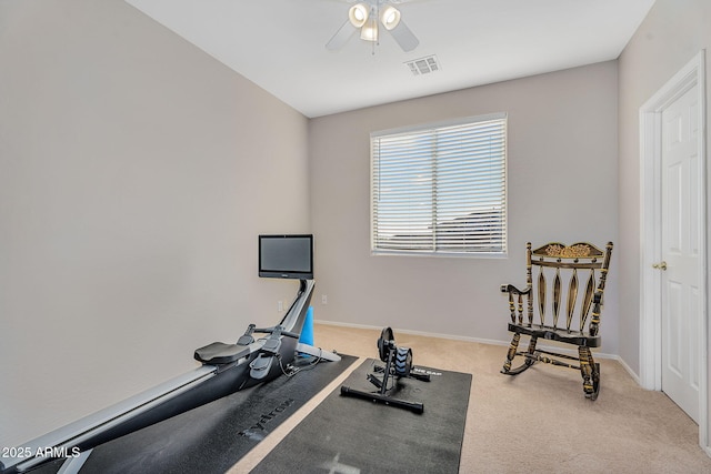 workout room featuring carpet, baseboards, visible vents, and a ceiling fan