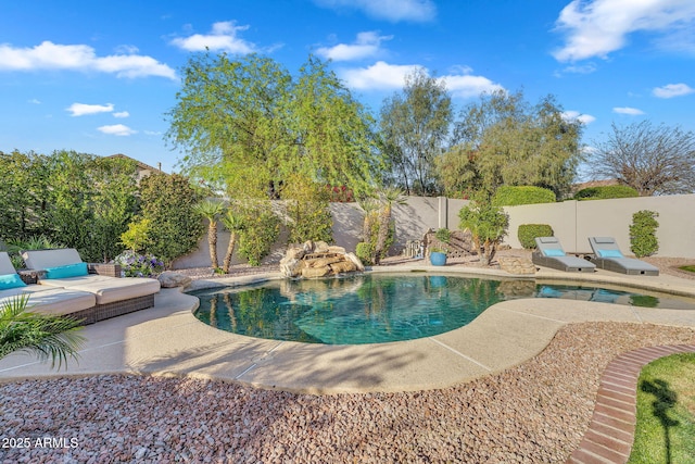 view of pool featuring a fenced in pool, a fenced backyard, and a patio area
