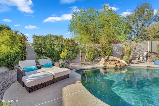 view of pool featuring a patio, a fenced in pool, and a fenced backyard