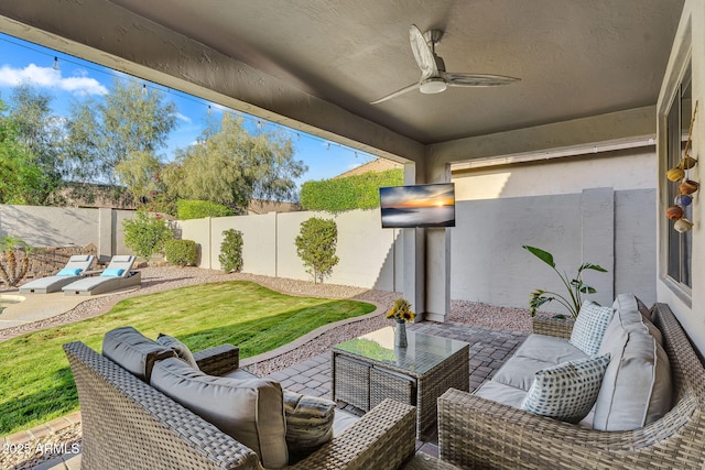 view of patio / terrace with a fenced backyard, a ceiling fan, and an outdoor living space