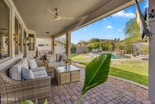 view of patio with outdoor lounge area, a fenced in pool, a fenced backyard, and a ceiling fan