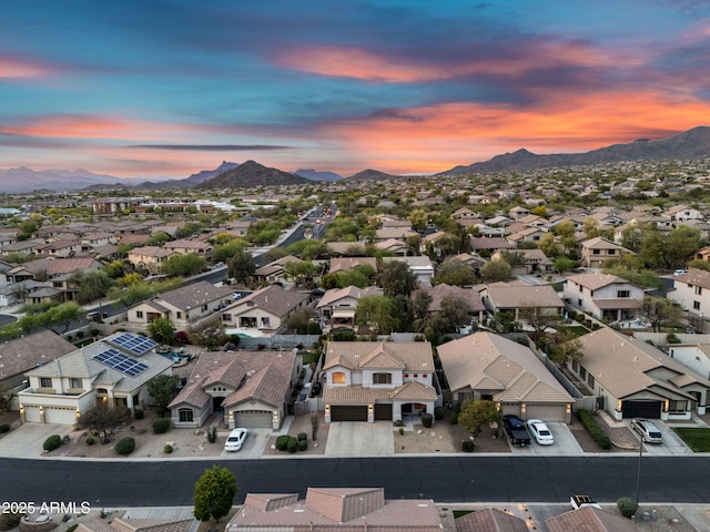 drone / aerial view with a residential view and a mountain view
