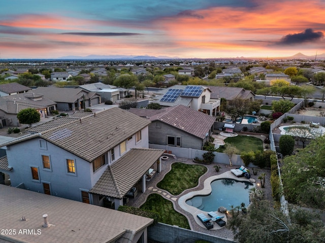 aerial view at dusk with a residential view
