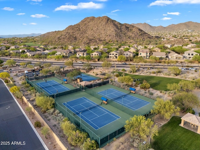 birds eye view of property with a mountain view and a residential view