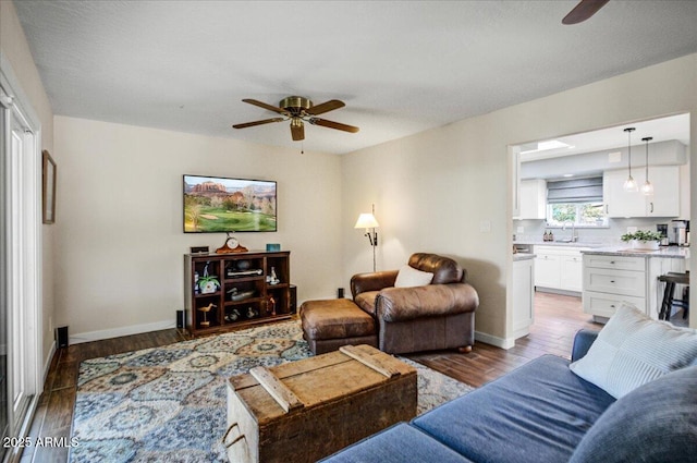 2846 E Lupine Ave, Phoenix, AZ 85028 - living room with baseboards, ceiling fan, and wood finished floors