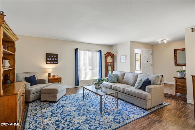 2846 E Lupine Ave, Phoenix, AZ 85028 - living room with baseboards, dark wood-type flooring, and visible vents