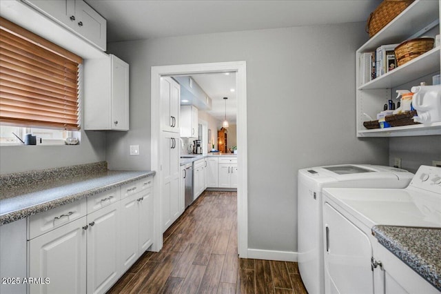 2846 E Lupine Ave, Phoenix, AZ 85028 - washroom with separate washer and dryer, cabinet space, dark wood-type flooring, and baseboards