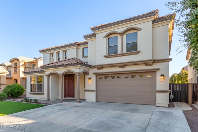 mediterranean / spanish-style house featuring a garage