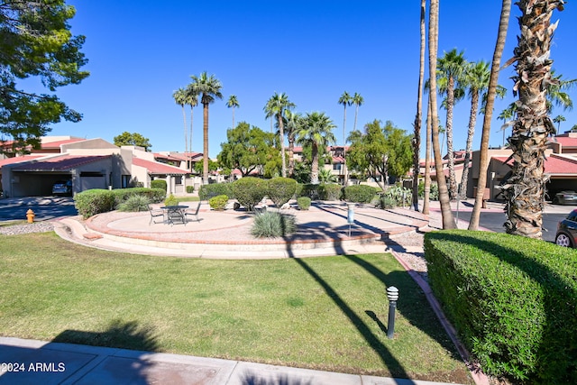 view of property's community featuring a lawn