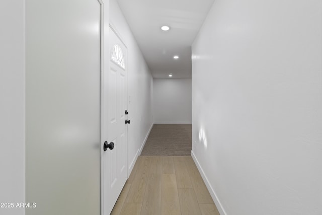 hall with light hardwood / wood-style flooring