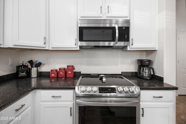 4221 S Fireside Ct, Gilbert, AZ 85297 - kitchen featuring stainless steel appliances, white cabinetry, and dark stone countertops
