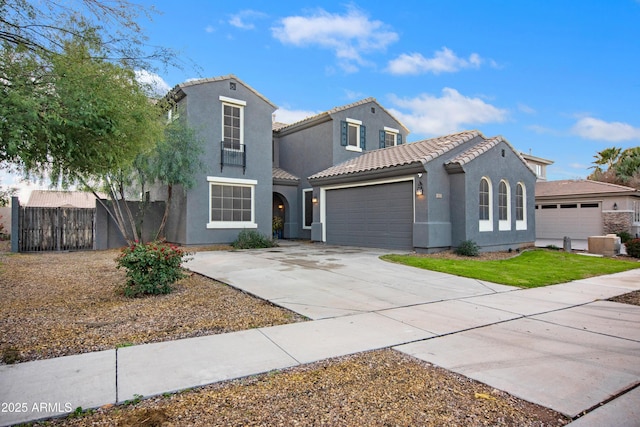 4221 S Fireside Ct, Gilbert, AZ 85297 - mediterranean / spanish-style house with stucco siding, a garage, a tiled roof, and concrete driveway