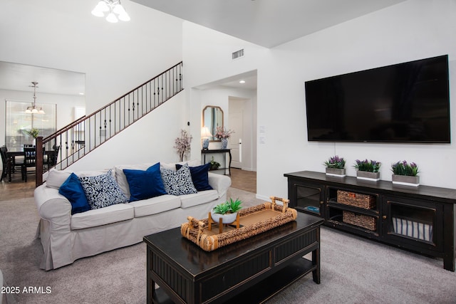 4221 S Fireside Ct, Gilbert, AZ 85297 - living area with a chandelier, carpet flooring, and stairs