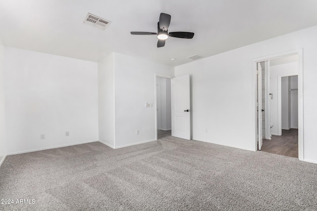 unfurnished bedroom with light colored carpet and ceiling fan