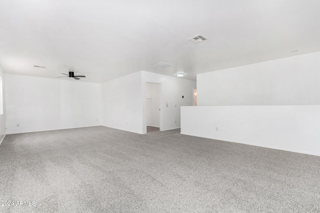 empty room featuring carpet and ceiling fan