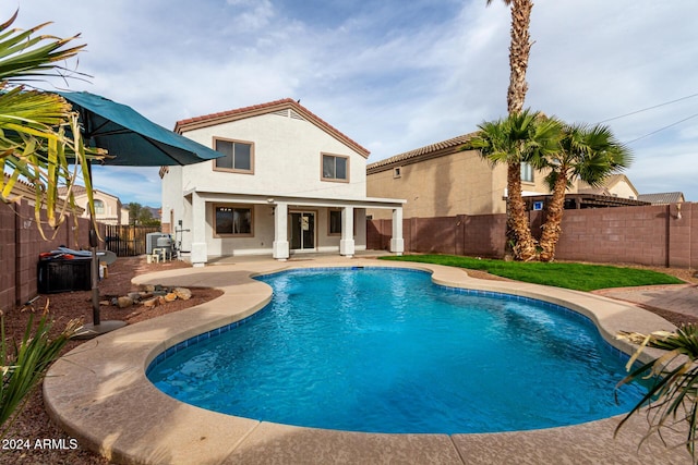 view of swimming pool with a patio area and central AC