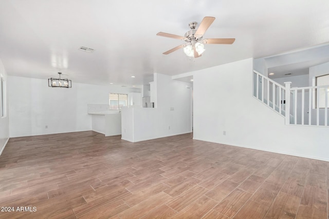 unfurnished living room featuring ceiling fan