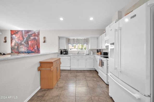 13051 N 75th Dr, Peoria, AZ 85381 - kitchen featuring white appliances, a sink, light countertops, recessed lighting, and light tile patterned flooring