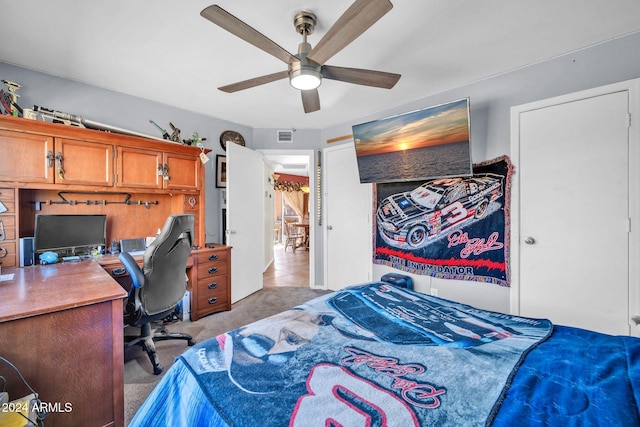 13051 N 75th Dr, Peoria, AZ 85381 - bedroom with light carpet, a desk, and ceiling fan