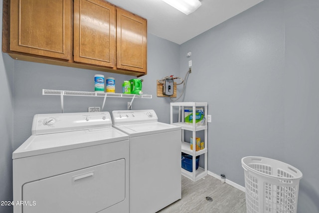 13051 N 75th Dr, Peoria, AZ 85381 - laundry room featuring cabinet space, separate washer and dryer, light wood finished floors, and baseboards