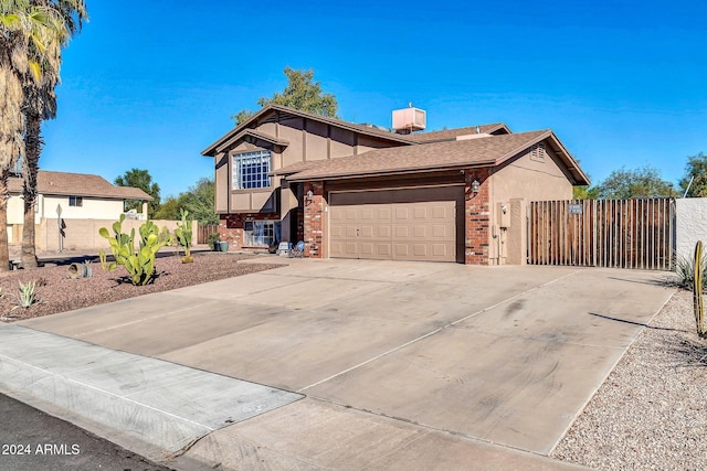 13051 N 75th Dr, Peoria, AZ 85381 - view of front of property with brick siding, an attached garage, concrete driveway, and fence