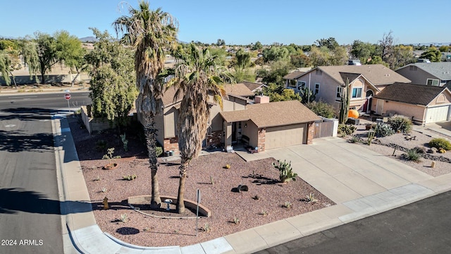 13051 N 75th Dr, Peoria, AZ 85381 - view of front of house featuring a residential view, concrete driveway, and an attached garage