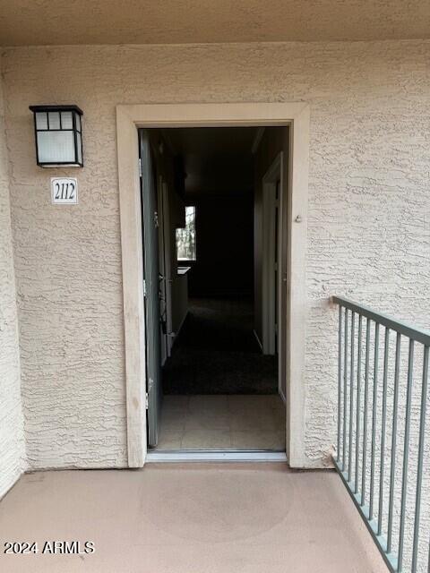 property entrance with a balcony