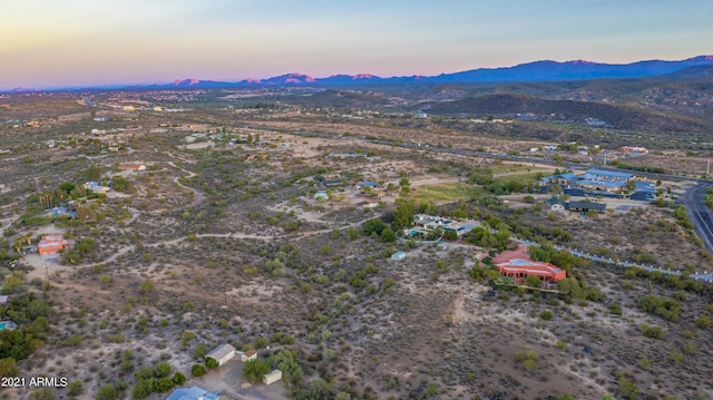 aerial view at dusk with a mountain view