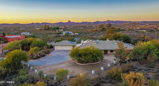 aerial view at dusk with a mountain view