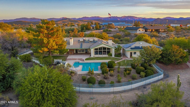 aerial view at dusk with a mountain view