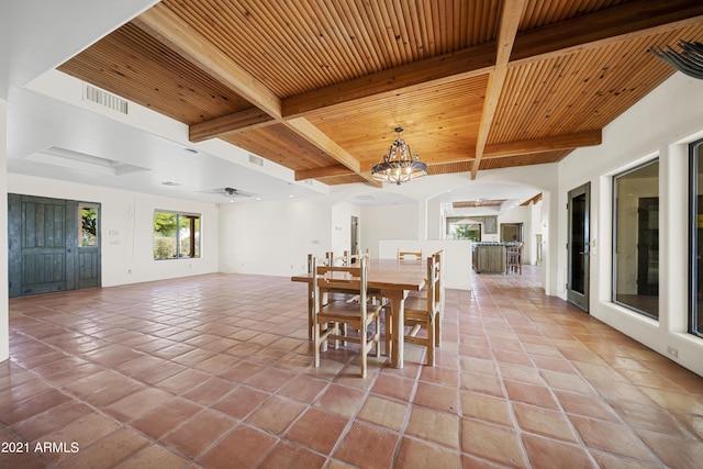 dining area featuring wood ceiling, beam ceiling, a chandelier, and light tile patterned flooring