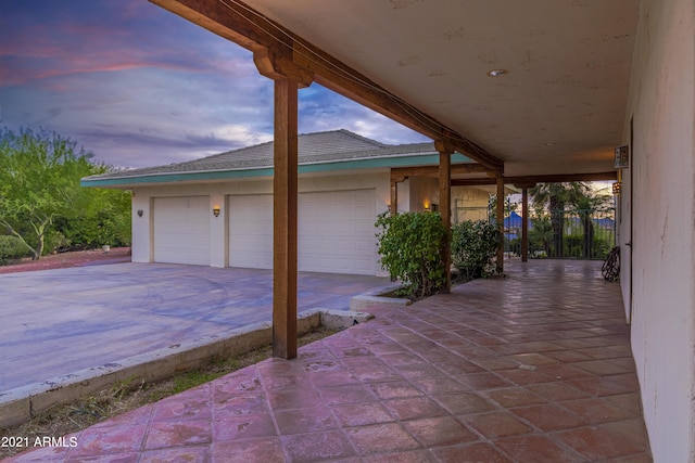 patio terrace at dusk with a garage